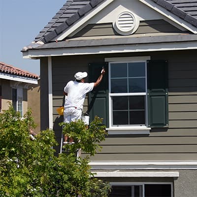 Painter finishing an exterior painting job